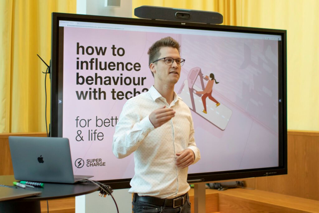 Speaker presenting how technology can influence healthier behaviour